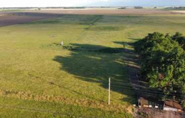 Campo de 24 has. con mejoras en Roque Perez frente ruta 205